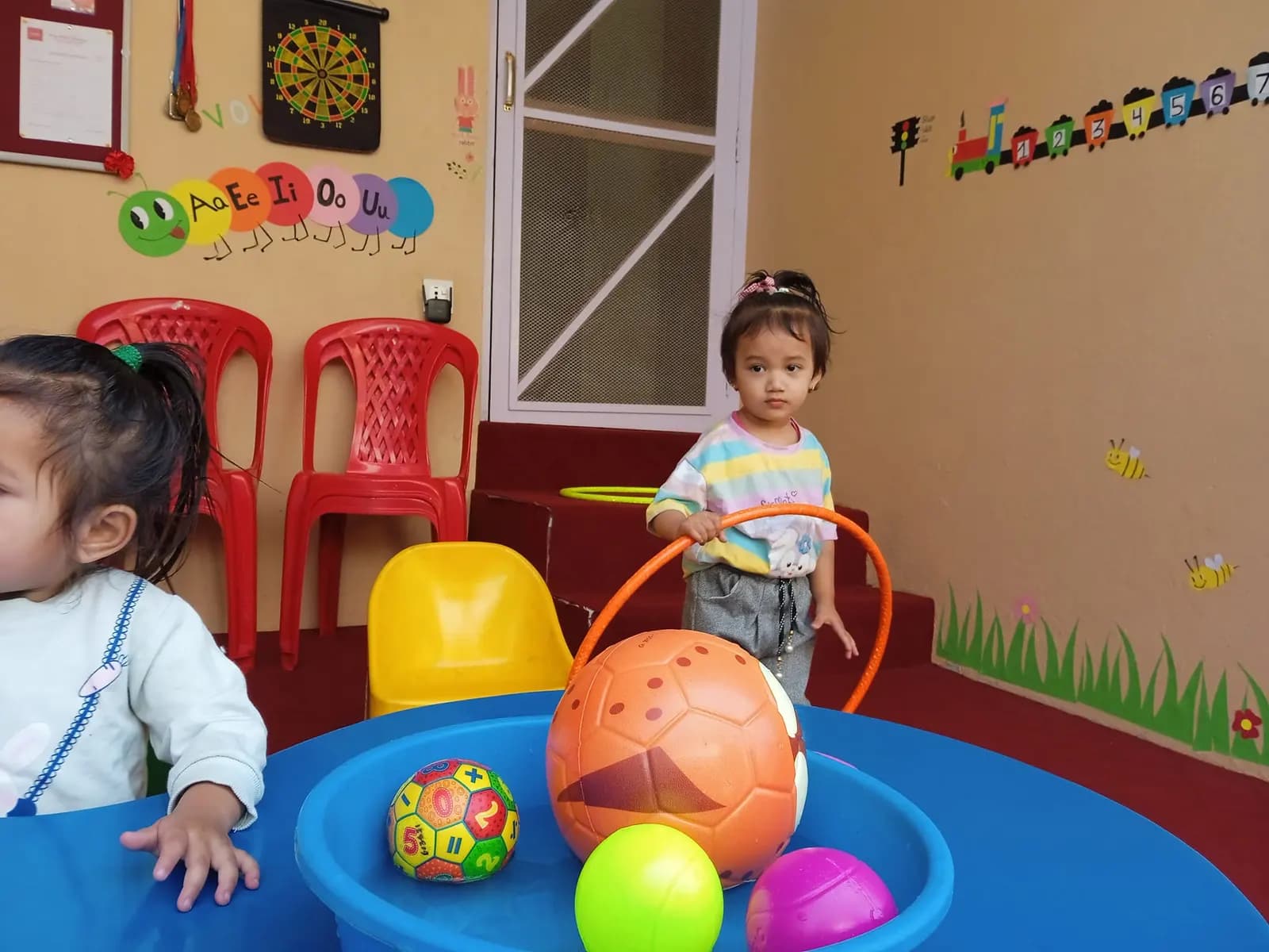 Children playing in the garden after class