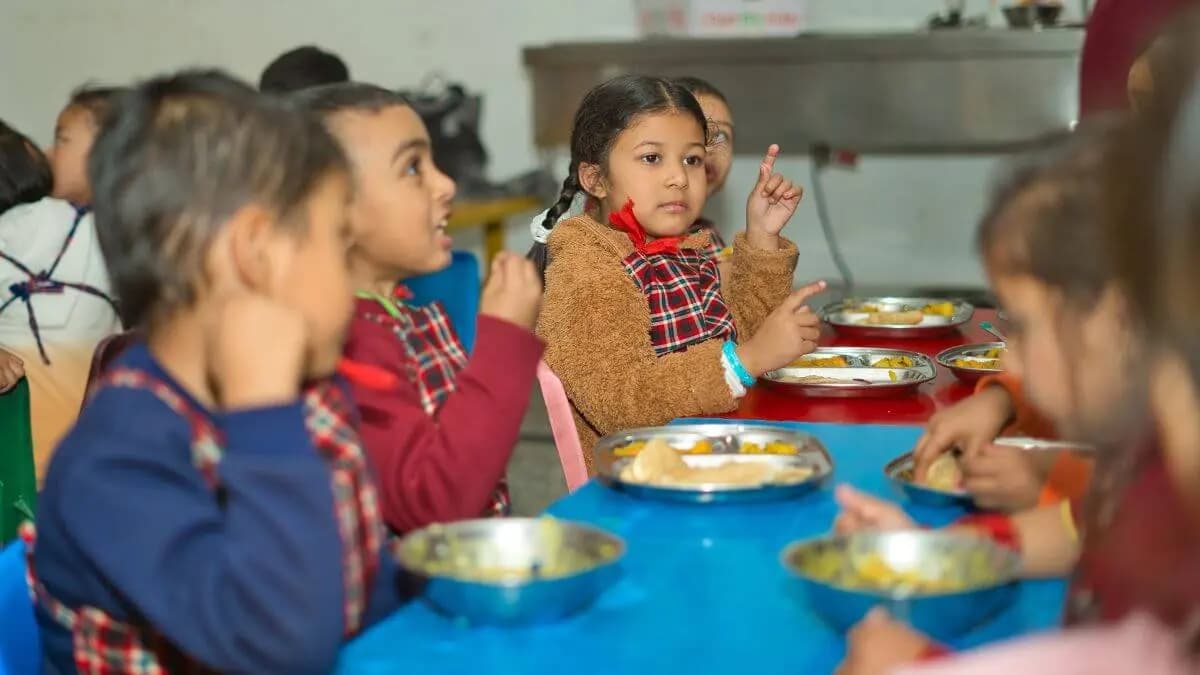 Children eating lunch at a low table